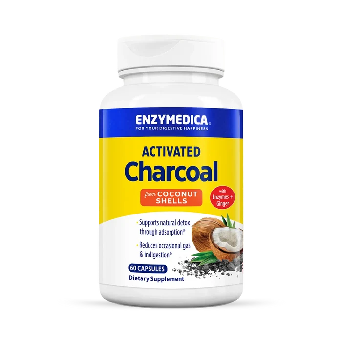 A bottle of Enzymedica Activated Charcoal dietary supplement, with an illustration of a coconut on the label, indicating it is made from coconut shells.