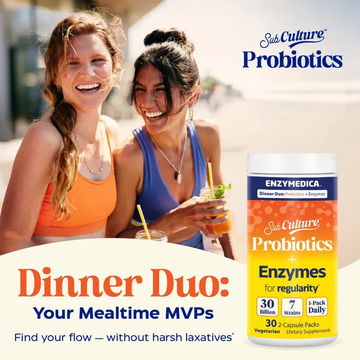 Two women enjoying drinks with a supplement container labeled 'Sub Culture Probiotics' on a beach.