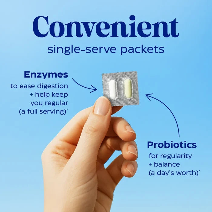 Hand holding a packet of two single-serve digestive enzymes and probiotics with text on a blue background.