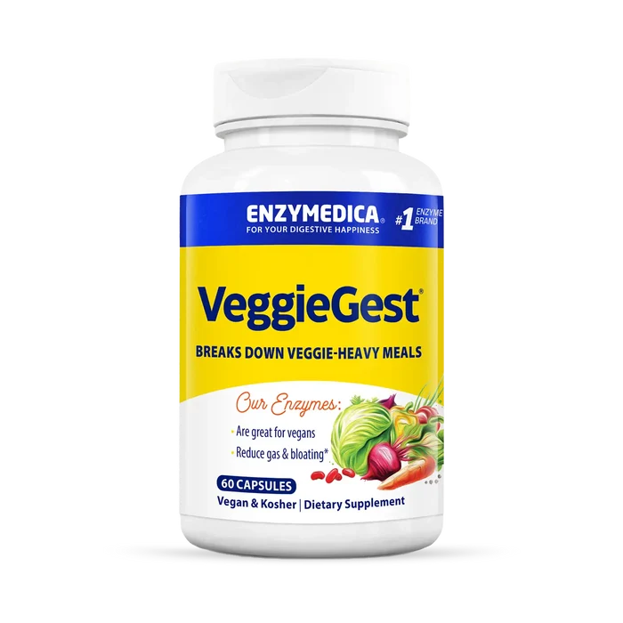 A bottle of VeggieGest dietary supplement by Enzymedica, with a label showing various fruits and vegetables indicating its use for breaking down vegetable-heavy meals.
